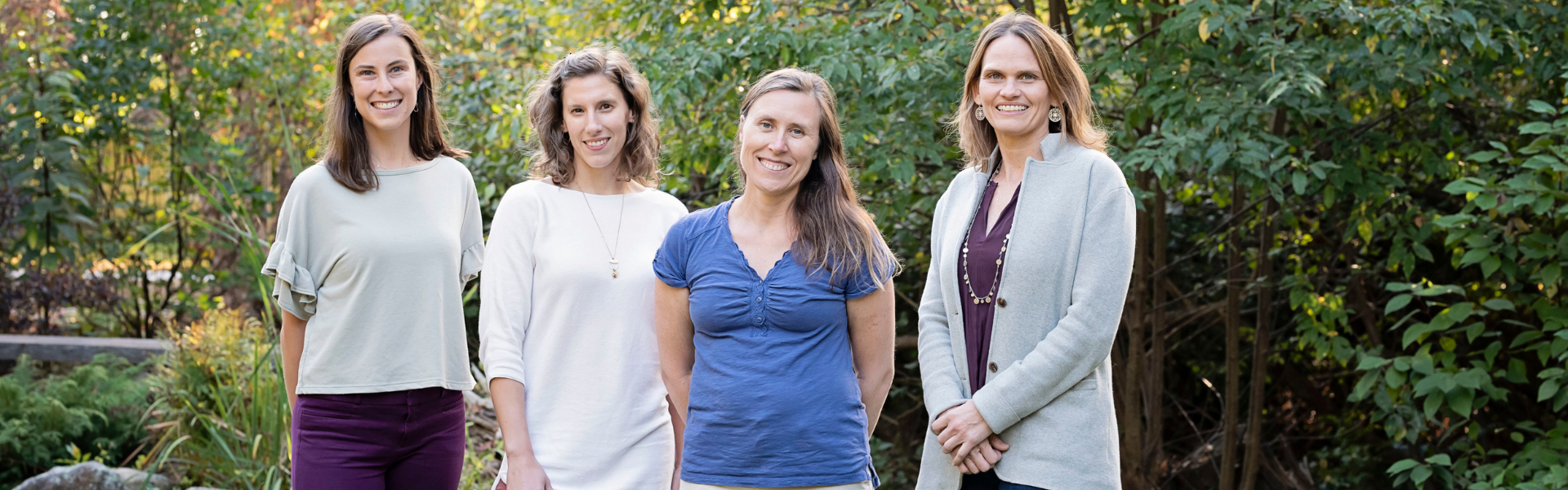4 white women standing in a park