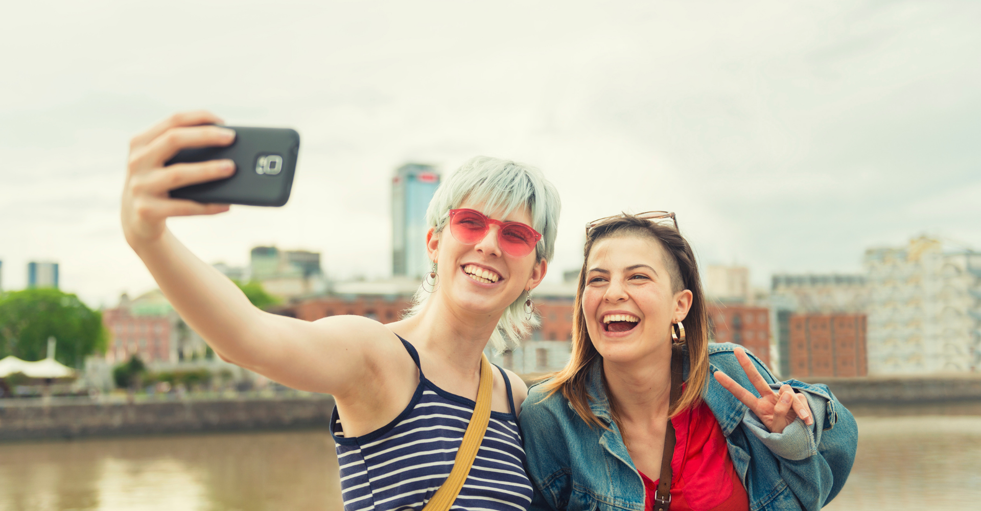 two queer women taking a selfie